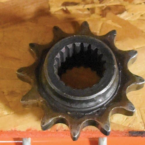 432056 | Tensioner Sprocket | New Holland L225 L325 L425 L445 |  | 249635