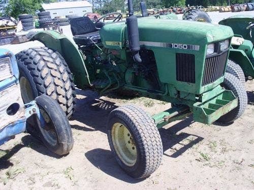 Used John Deere 1050 Tractor parts.