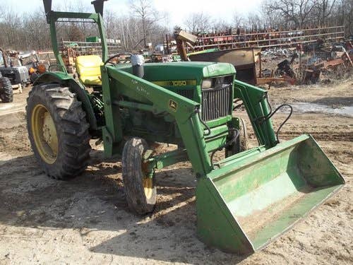 Used John Deere 1050 Tractor parts.