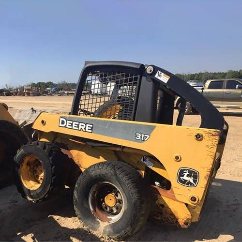 Used John Deere 317 Skid Steer Loader parts.