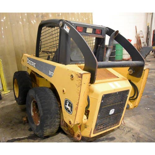 Used John Deere 317 Skid Steer Loader parts.