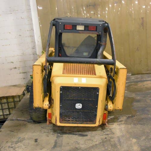 Used John Deere 317 Skid Steer Loader parts.