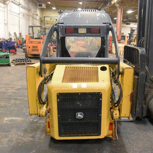 Used John Deere 317 Skid Steer Loader parts.