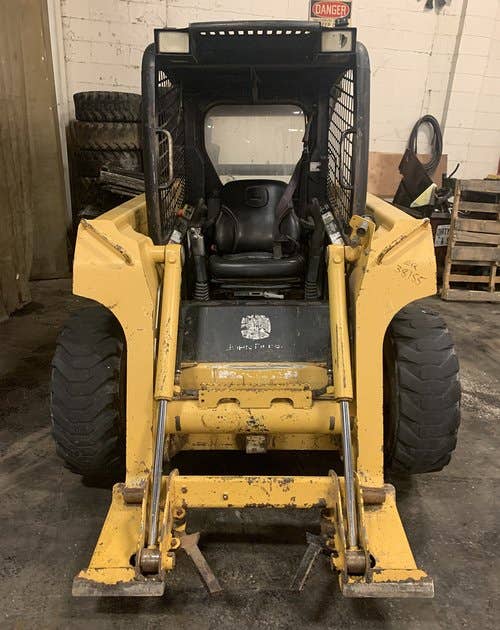 Used John Deere 317 Skid Steer Loader parts.