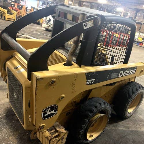 Used John Deere 317 Skid Steer Loader parts.
