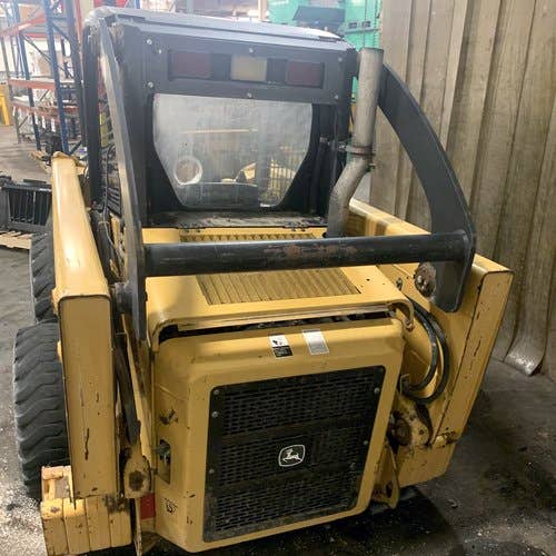 Used John Deere 317 Skid Steer Loader parts.