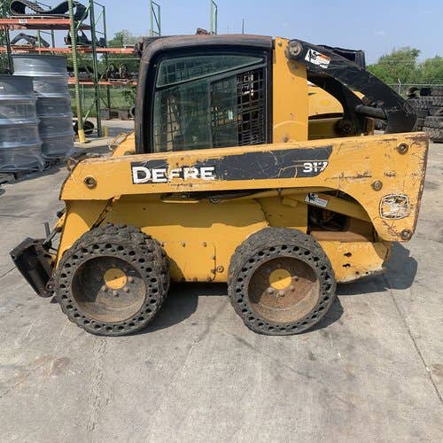 Used John Deere 317 Skid Steer Loader parts.