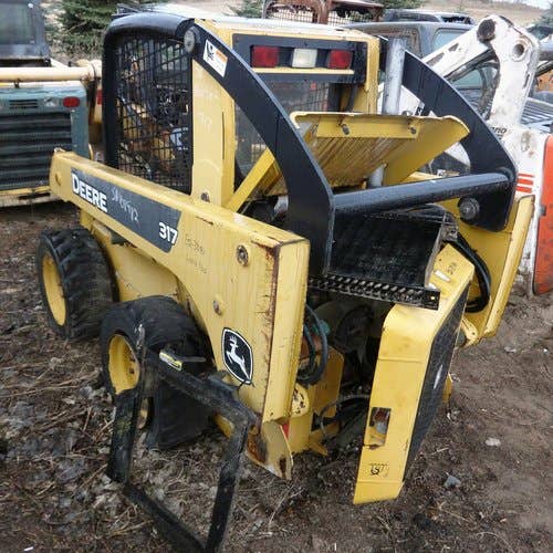 Used John Deere 317 Skid Steer Loader parts.
