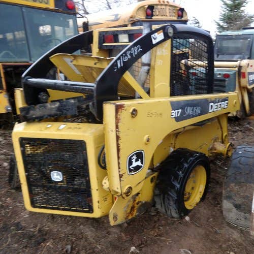 Used John Deere 317 Skid Steer Loader parts.