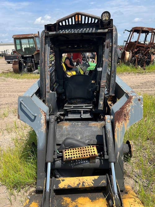 Used John Deere 317 Skid Steer Loader parts.