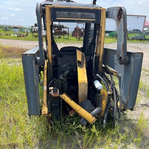Used John Deere 317 Skid Steer Loader parts.