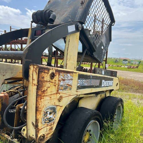 Used John Deere 317 Skid Steer Loader parts.