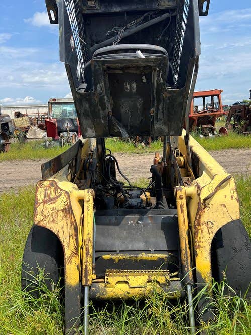Used John Deere 317 Skid Steer Loader parts.