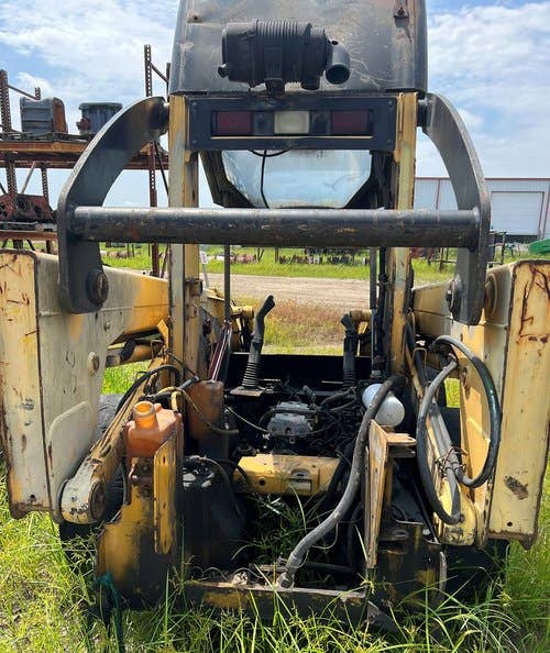 Used John Deere 317 Skid Steer Loader parts.