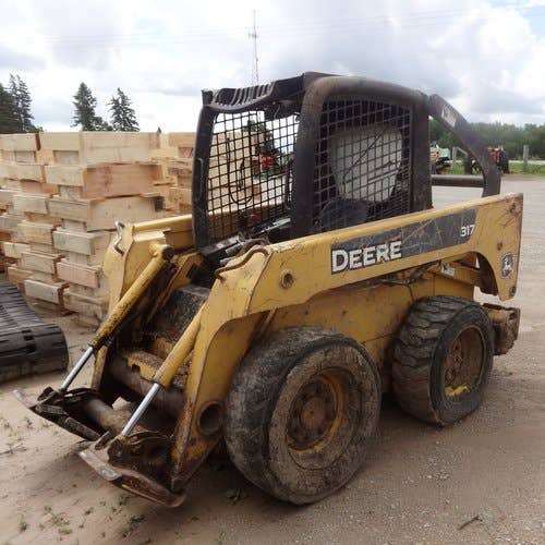 Used John Deere 317 Skid Steer Loader parts.