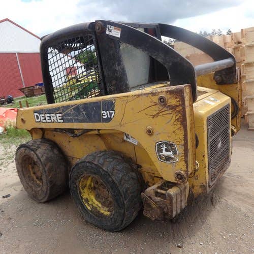 Used John Deere 317 Skid Steer Loader parts.
