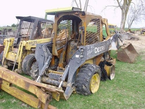 Used John Deere 318 Skid Steer Loader parts.