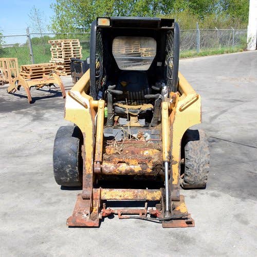 Used John Deere 320 Skid Steer Loader parts.