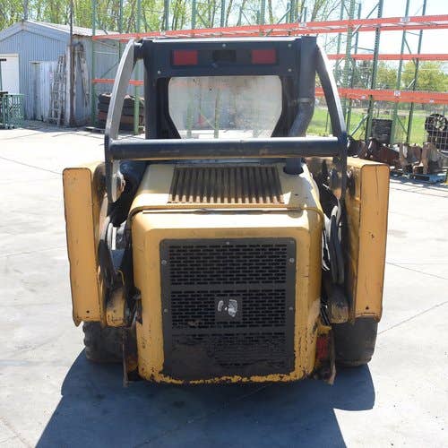 Used John Deere 320 Skid Steer Loader parts.