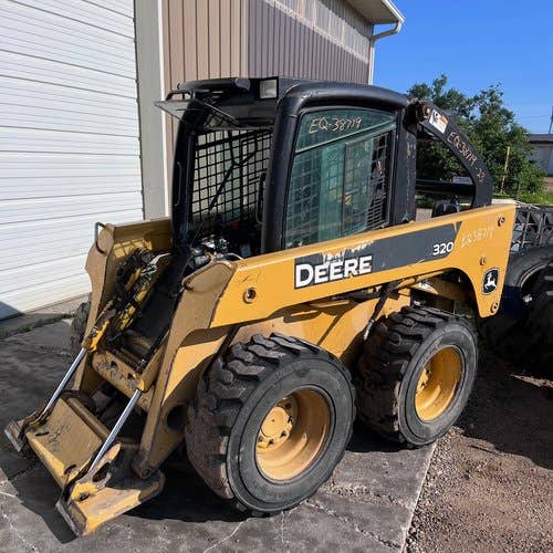 Used John Deere 320 Skid Steer Loader parts.
