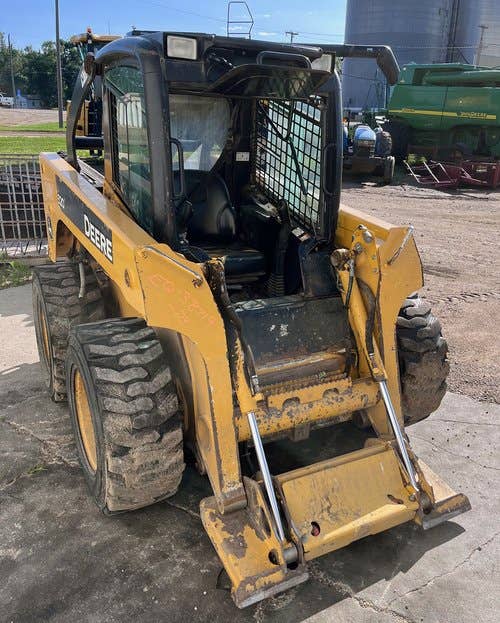 Used John Deere 320 Skid Steer Loader parts.