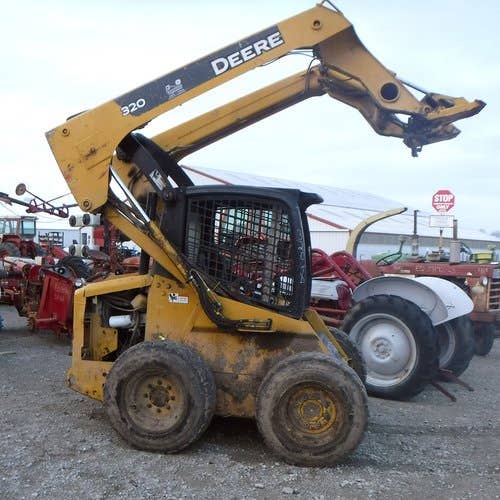 Used John Deere 320 Skid Steer Loader parts.