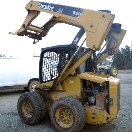 Used John Deere 320 Skid Steer Loader parts.