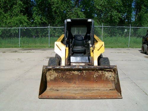Used John Deere 325 Skid Steer Loader parts.