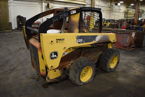 Used John Deere 325 Skid Steer Loader parts.
