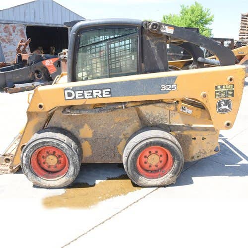 Used John Deere 325 Skid Steer Loader parts.