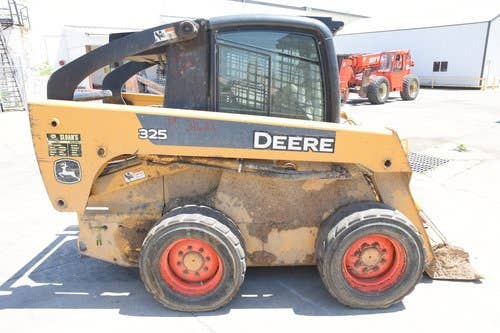 Used John Deere 325 Skid Steer Loader parts.