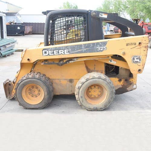 Used John Deere 325 Skid Steer Loader parts.