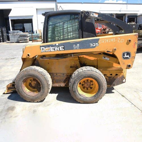 Used John Deere 325 Skid Steer Loader parts.