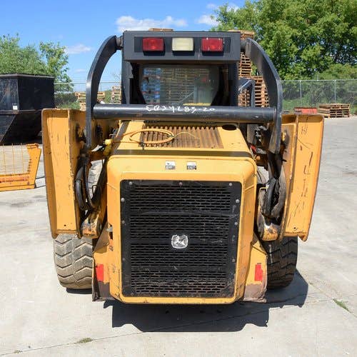 Used John Deere 325 Skid Steer Loader parts.
