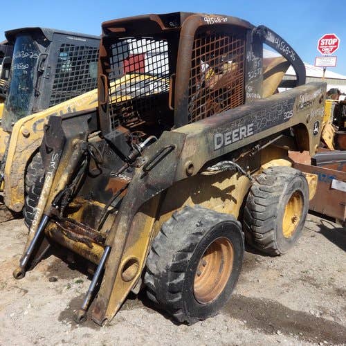 Used John Deere 325 Skid Steer Loader parts.