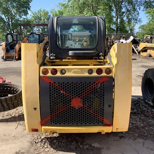 Used New Holland L215 Skid Steer Loader parts.