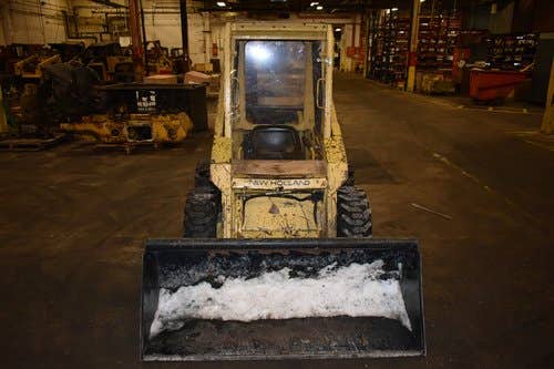 Used New Holland L425 Skid Steer Loader parts.