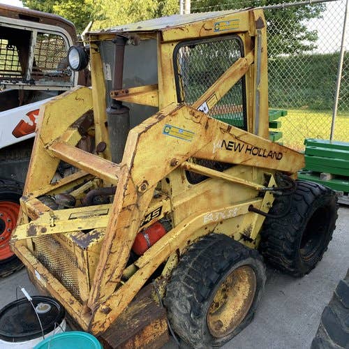 Used New Holland L445 Skid Steer Loader parts.