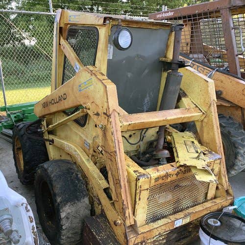 Used New Holland L445 Skid Steer Loader parts.