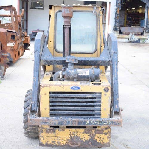 Used New Holland L454 Skid Steer Loader parts.