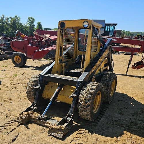 Used New Holland L553 Skid Steer Loader parts.