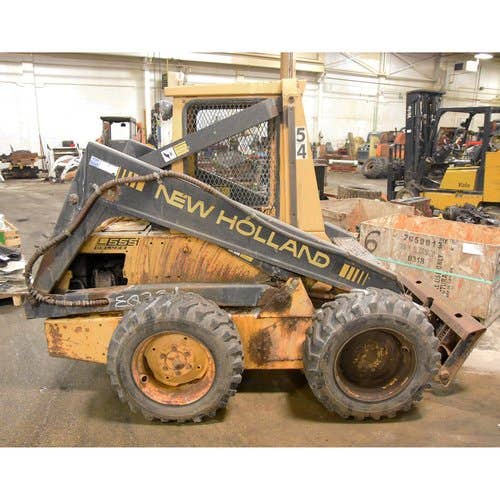 Used New Holland L555 Skid Steer Loader parts.
