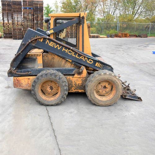 Used New Holland L555 Skid Steer Loader parts.