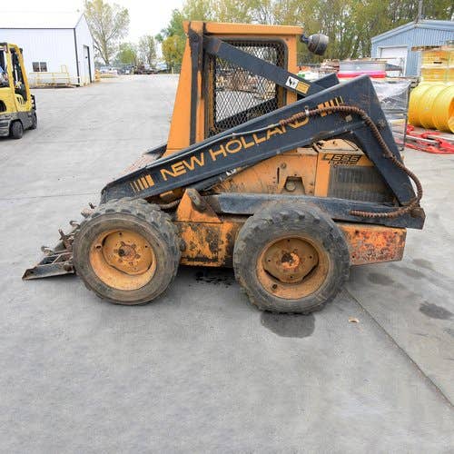 Used New Holland L555 Skid Steer Loader parts.