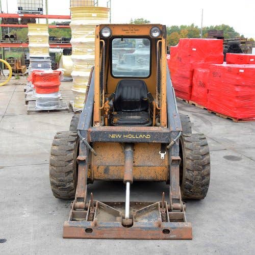 Used New Holland L555 Skid Steer Loader parts.