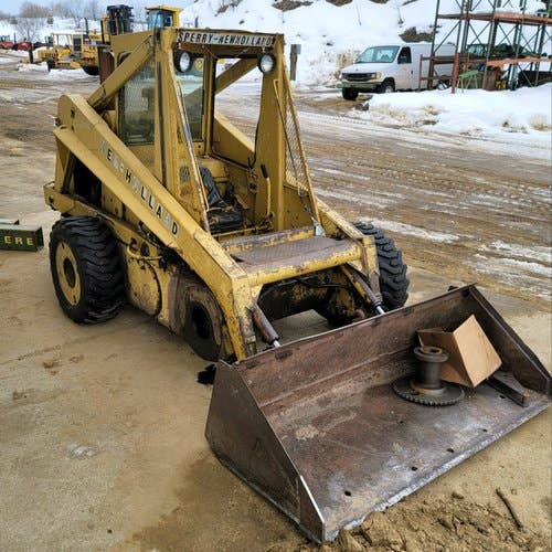 Used New Holland L779 Skid Steer Loader parts.