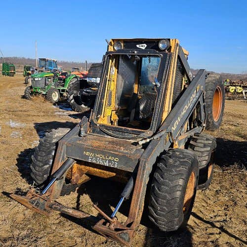 Used New Holland L783 Skid Steer Loader parts.