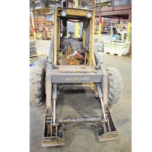 1990 Used New Holland L785 Skid Steer Loader parts.
