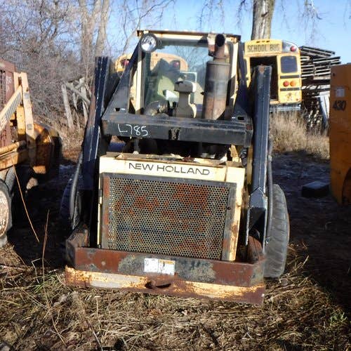 Used New Holland l785 Skid Steer Loader parts.