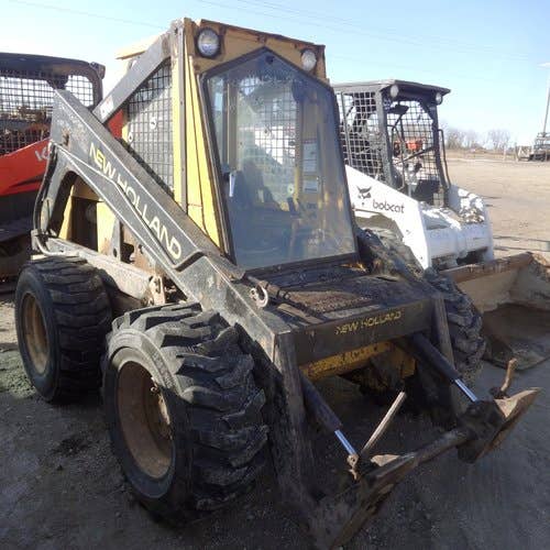 Used New Holland L785 Skid Steer Loader parts.
